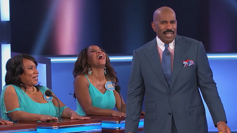 two women laugh by Steve Harvey