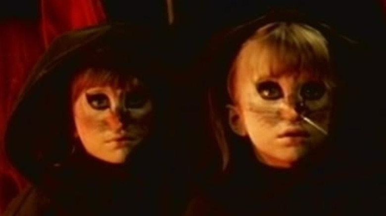 Mary-Kate and Ashley Olson look surprised wearing cat makeup