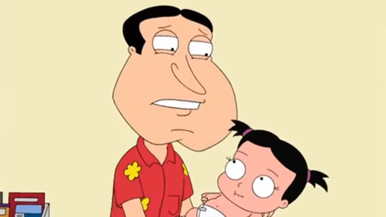 Quagmire holding a baby