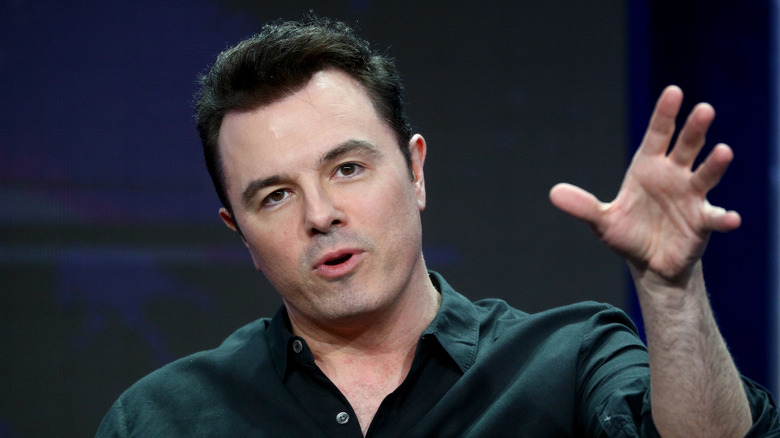 Seth MacFarlane extending his arm