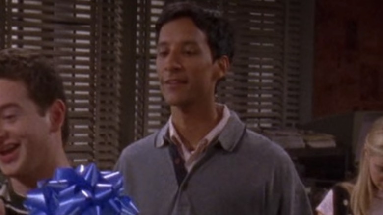 Raj looks at Rory's gift