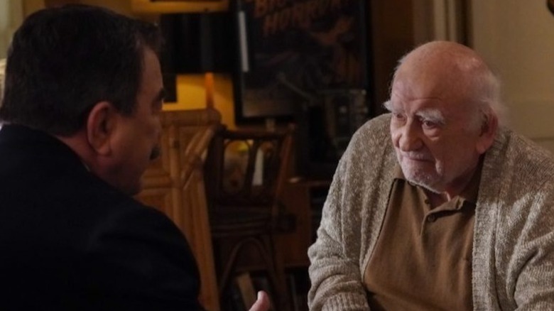 Ed Asner and Tom Selleck sitting and talking