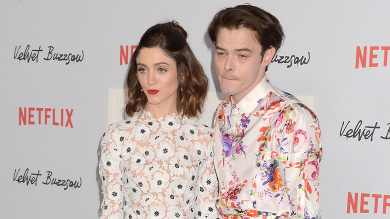 Natalia Dyer and Charlie Heaton pose together