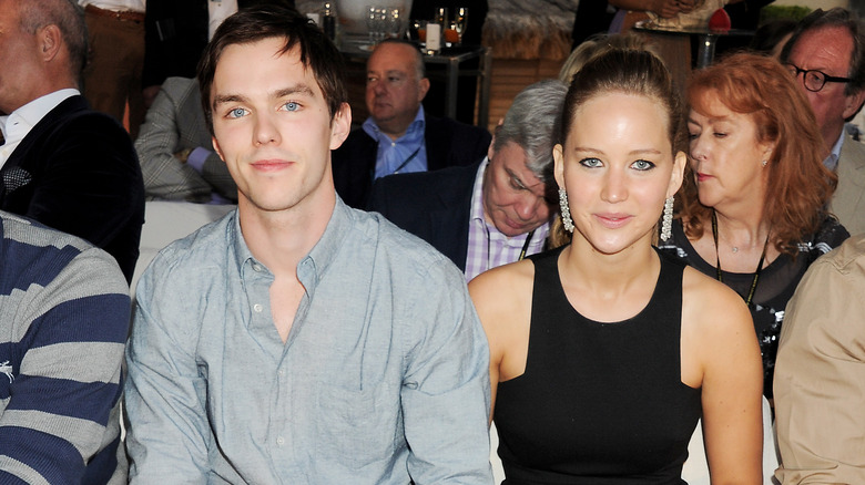 Nicholas Hoult sits with Jennifer Lawrence