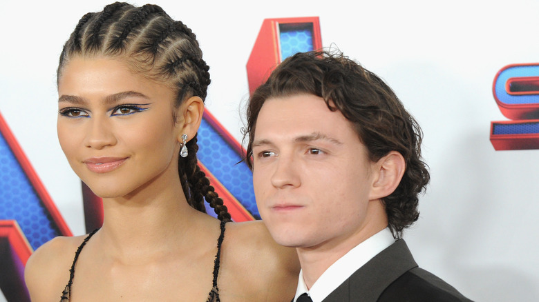 Zendaya stands beside Tom Holland