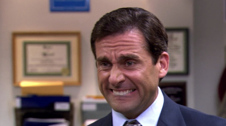 Michael Scott grimacing