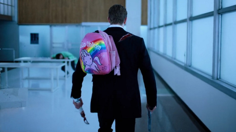 Takeshi Kovacs wearing a pink backpack