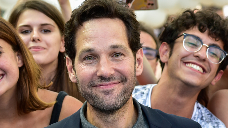 Paul Rudd smiling in front of fans