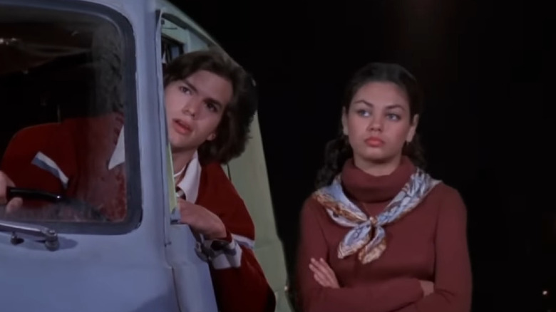 Kelso in van next to Jackie