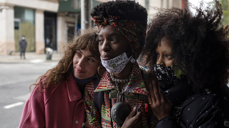 Women hug on the streets of New York City