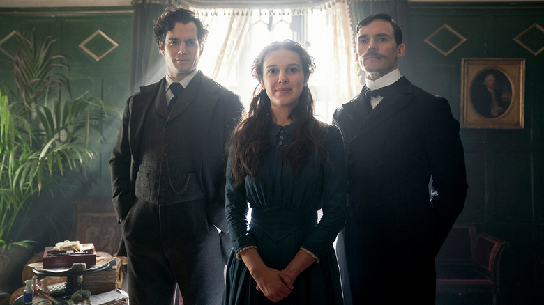 Henry Cavill as Sherlock Holmes, Millie Bobby Brown as Enola Holmes and Sam Claflin as Mycroft Holmes