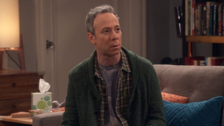 Stuart in The Big Bang Theory sitting down