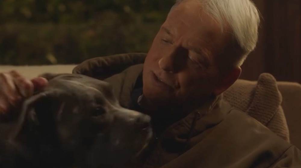 Leroy Gibbs petting his dog