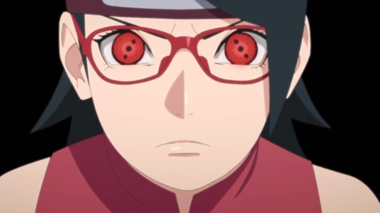 Sarada looks forward with red eyes 