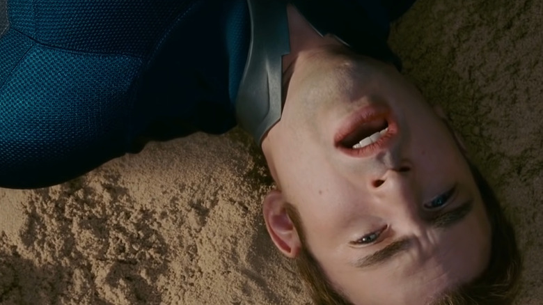 Johnny Storm lies exhausted in the sand