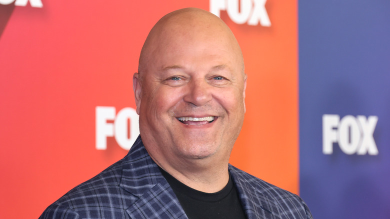 Chiklis stands on a red carpet