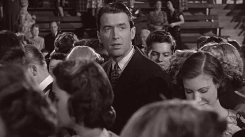 George Bailey amidst a crowd