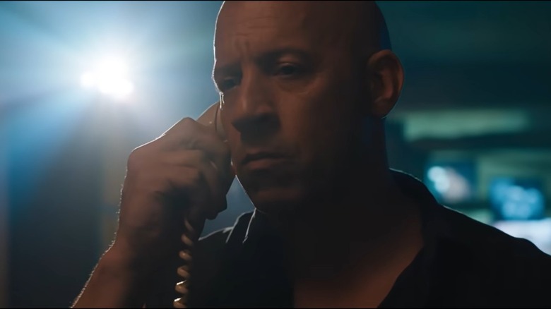 Dominic Toretto holding a phone to his ear