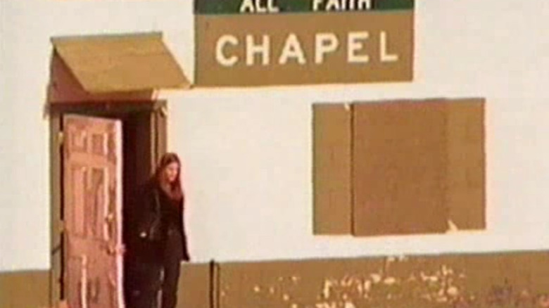 Woman walking out of prison chapel