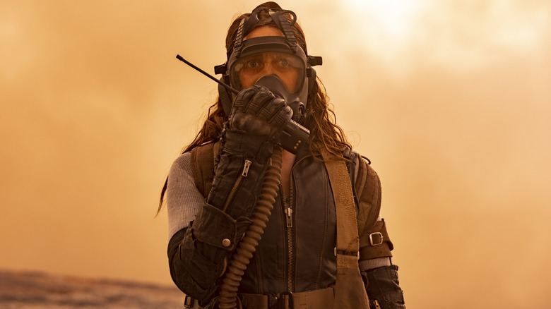 Alicia wearing a gas mask