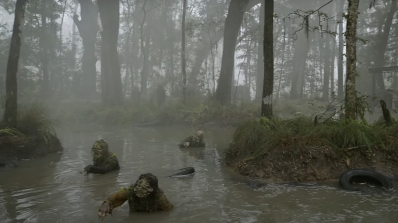 Zombies moving through swamp 