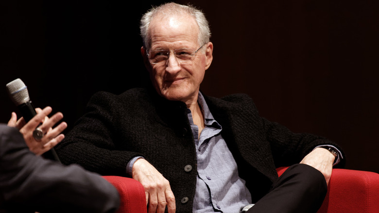 Michael Mann sits in a chair