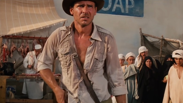 Indiana Jones holding his gun