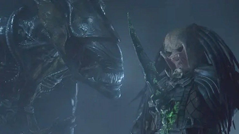 A xenomorph impales a Predator