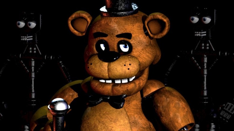 Freddy holding microphone