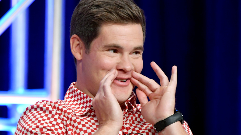 Adam Devine smirking