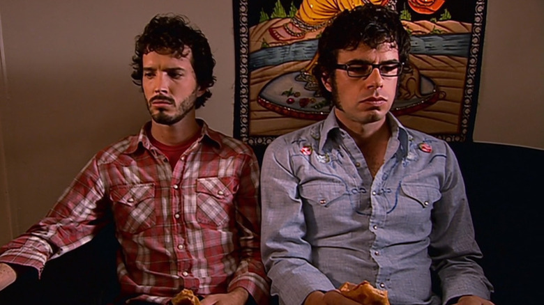 Bret and Jemaine sitting on couch