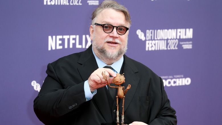 Guillermo Del Toro holding Pinocchio