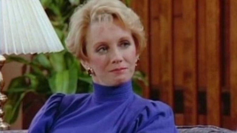 Sandy Duncan sits on couch