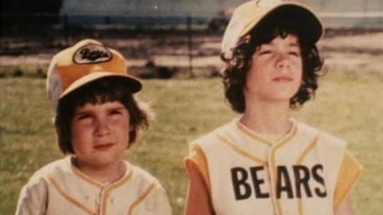 Two little leaguers practicing