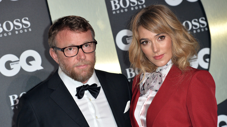 Guy Ritchie poses with his wife