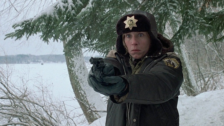 Frances McDormand pointing a gun