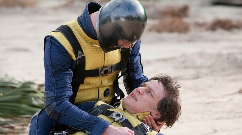 Erik holds Charles on beach