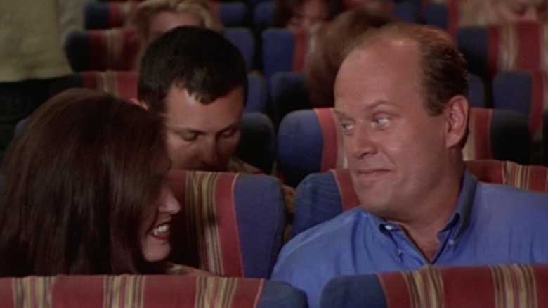 Frasier and his girlfriend exchange glances