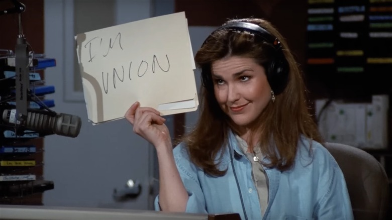 Roz holding "I'm Union" sign