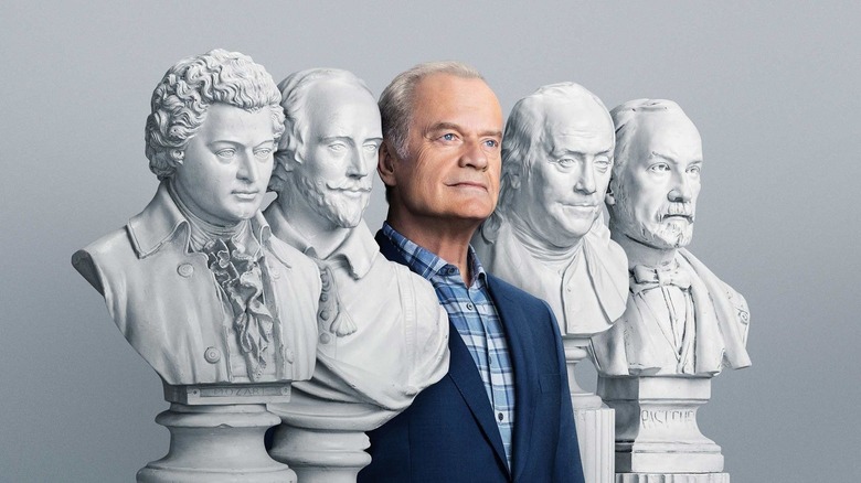 Fraiser posing with statues