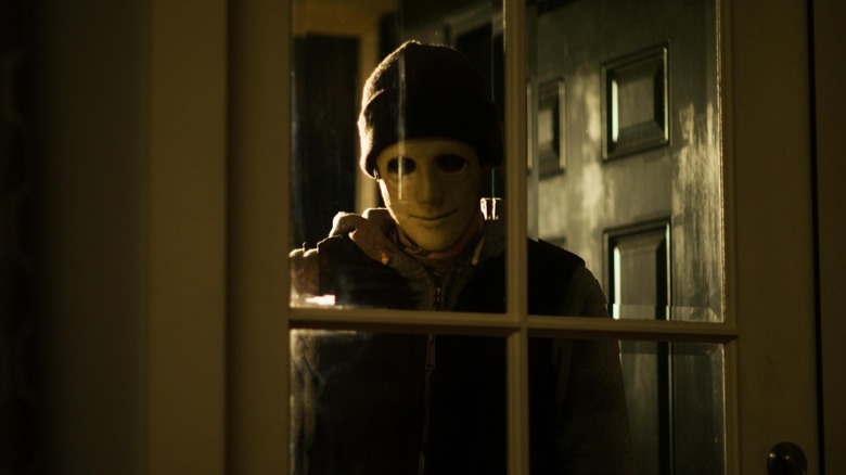 Masked man from Hush staring