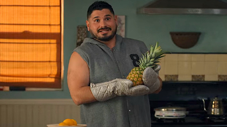 Tio Tonio holding pineapple