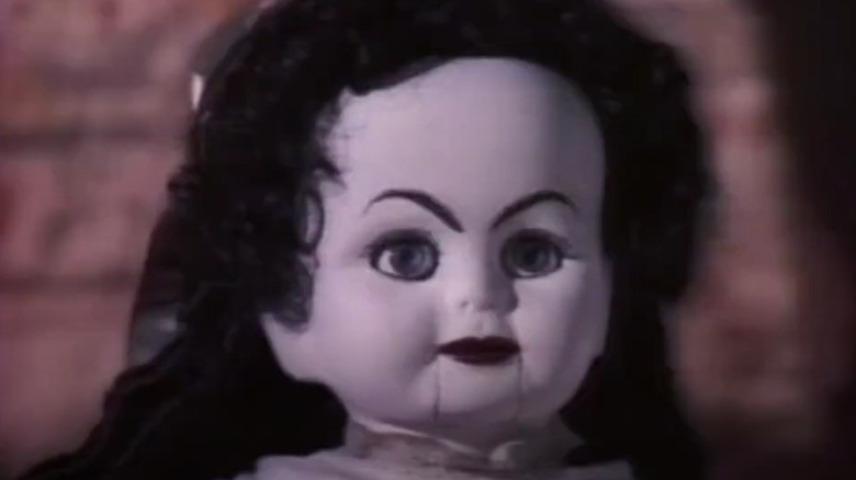 scary doll looks mad