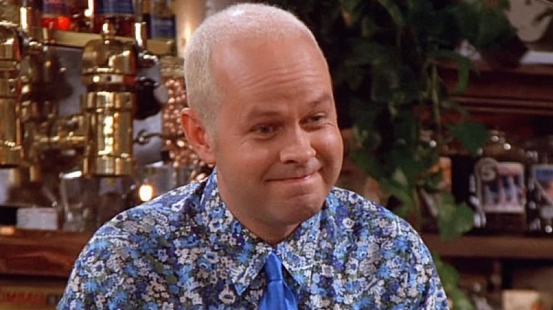 Gunther smiles behind the Central Perk counter on "Friends"