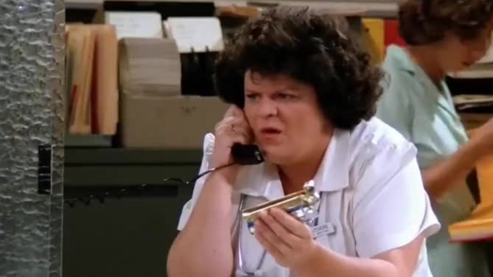 Friends nurse on the phone holding candy bar