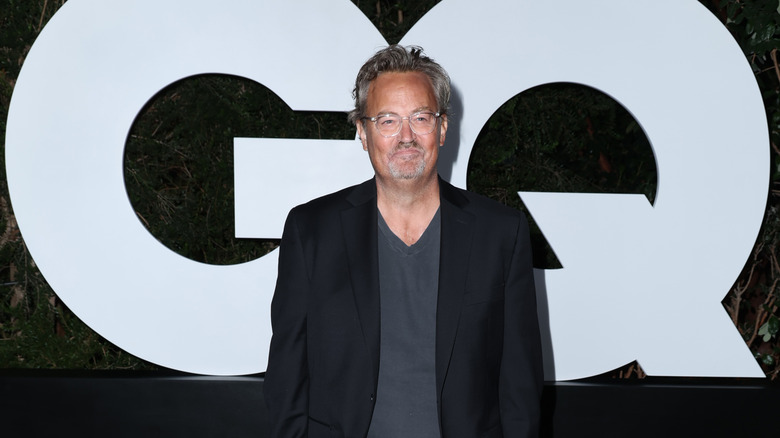 Matthew Perry smiling at event