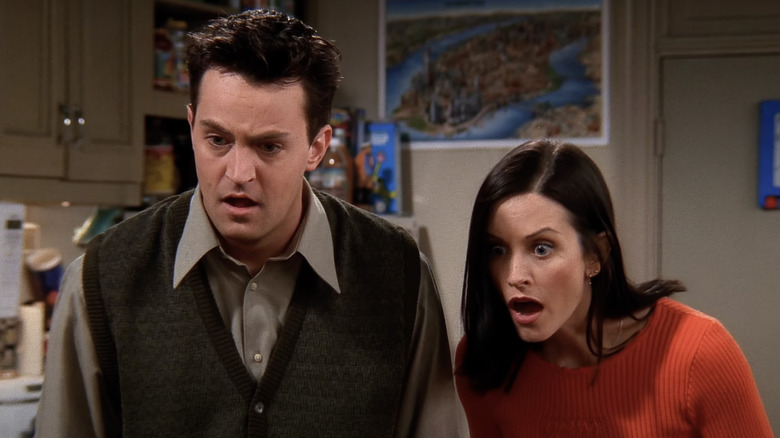 Chandler and Monica looking shocked