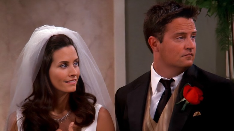 Monica Geller and Chandler Bing looking to the right