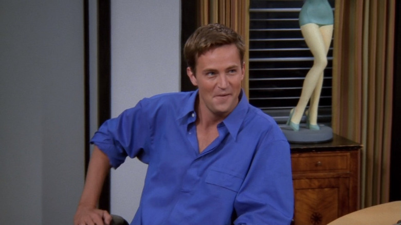 Chandler Bing sitting in chair