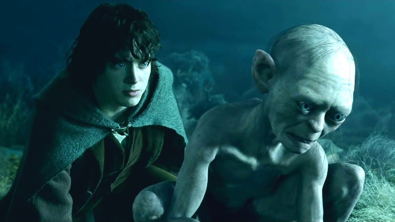 Frodo kneeling by Gollum